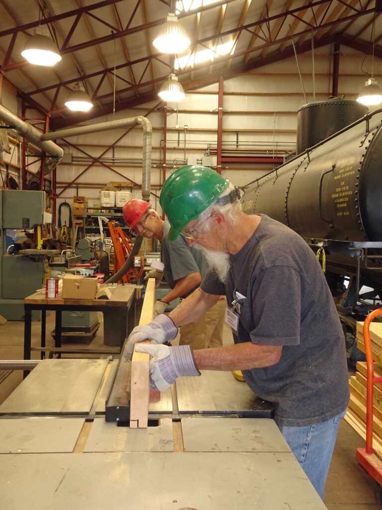 Image of boards being cut for use on the railway